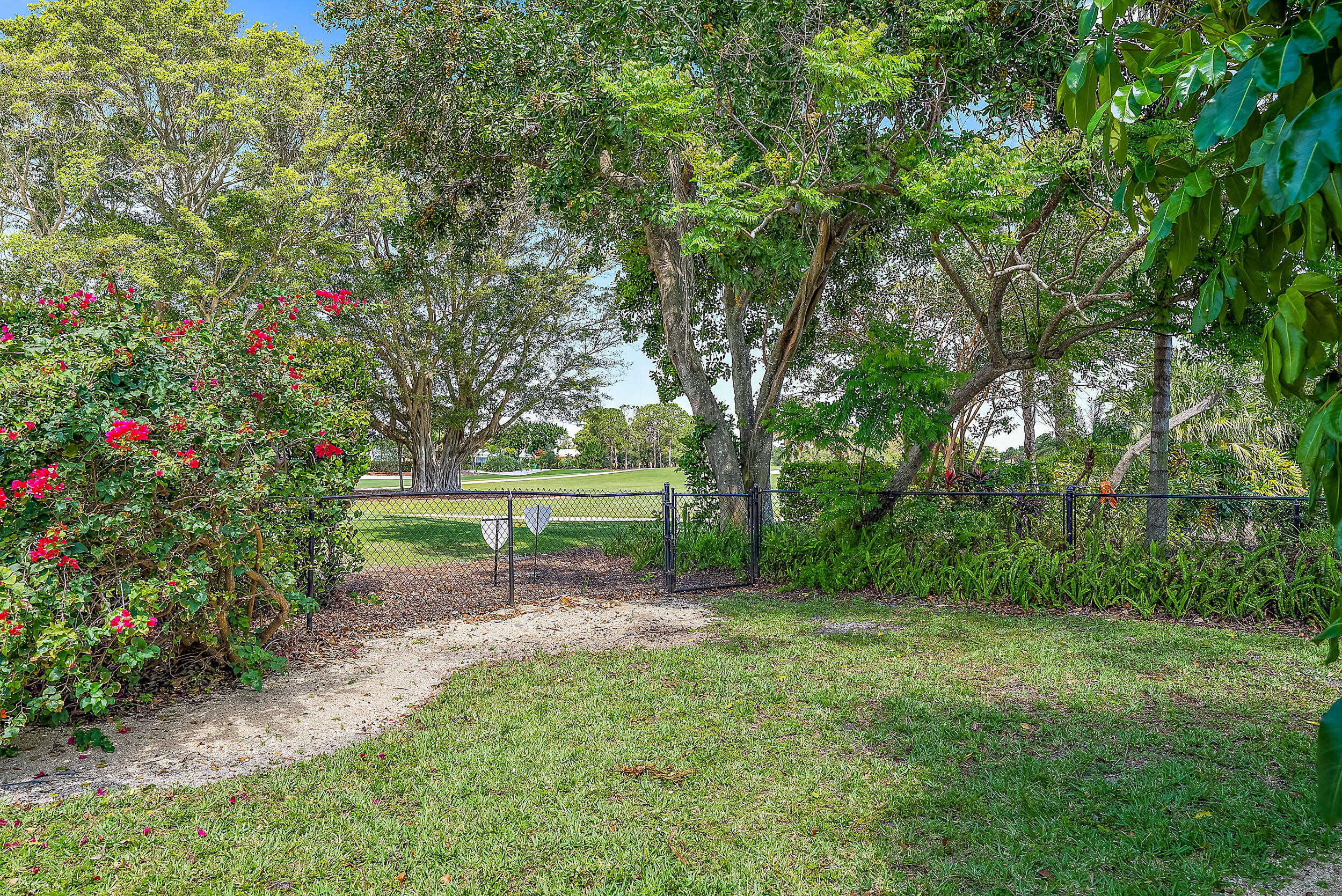83 Fairview West Tequesta, FL 33469 - Photo 25 of 32 a view of a park with large trees