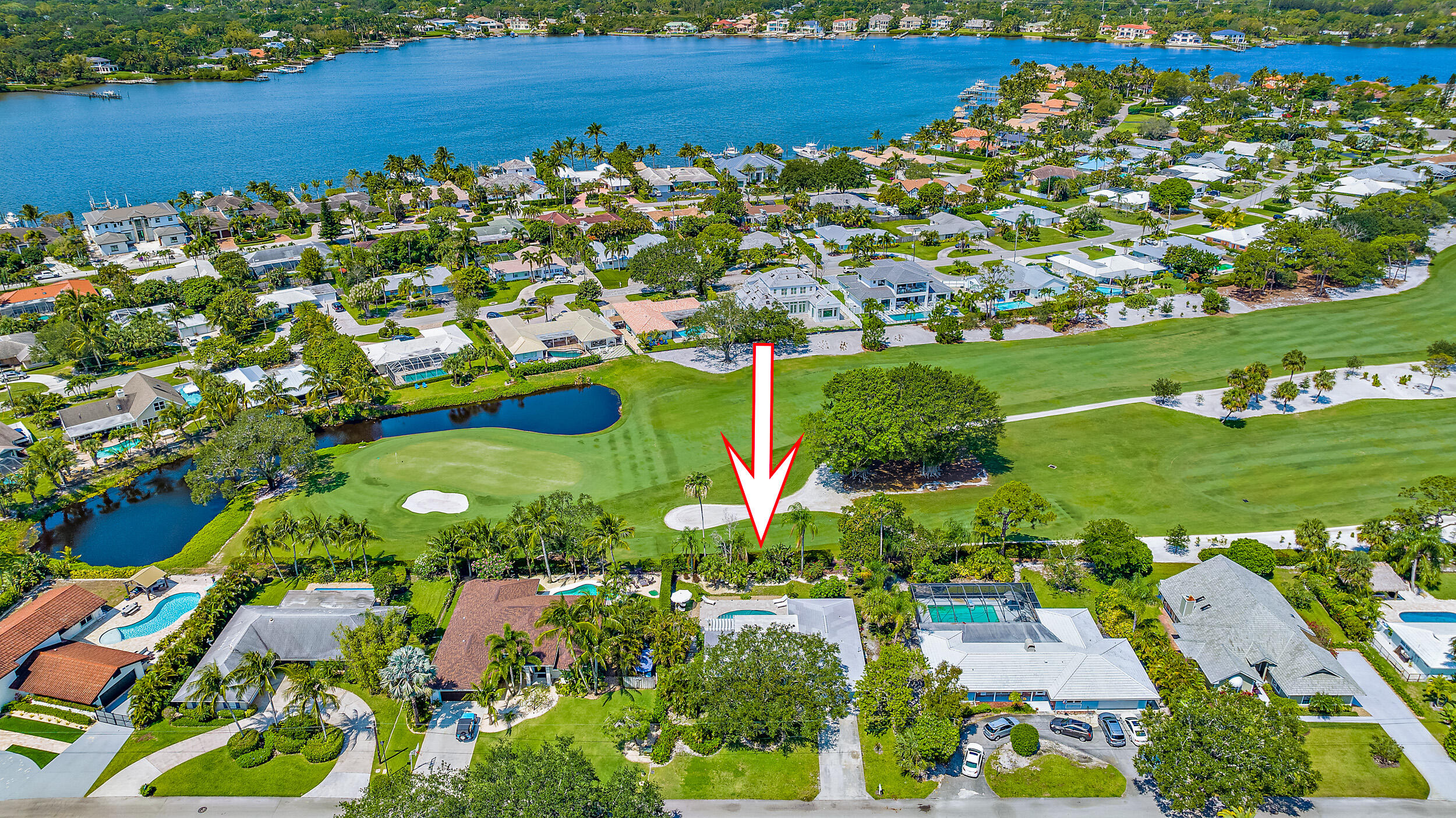 83 Fairview West Tequesta, FL 33469 - Photo 32 of 32 an aerial view of a residential houses with outdoor space and street view