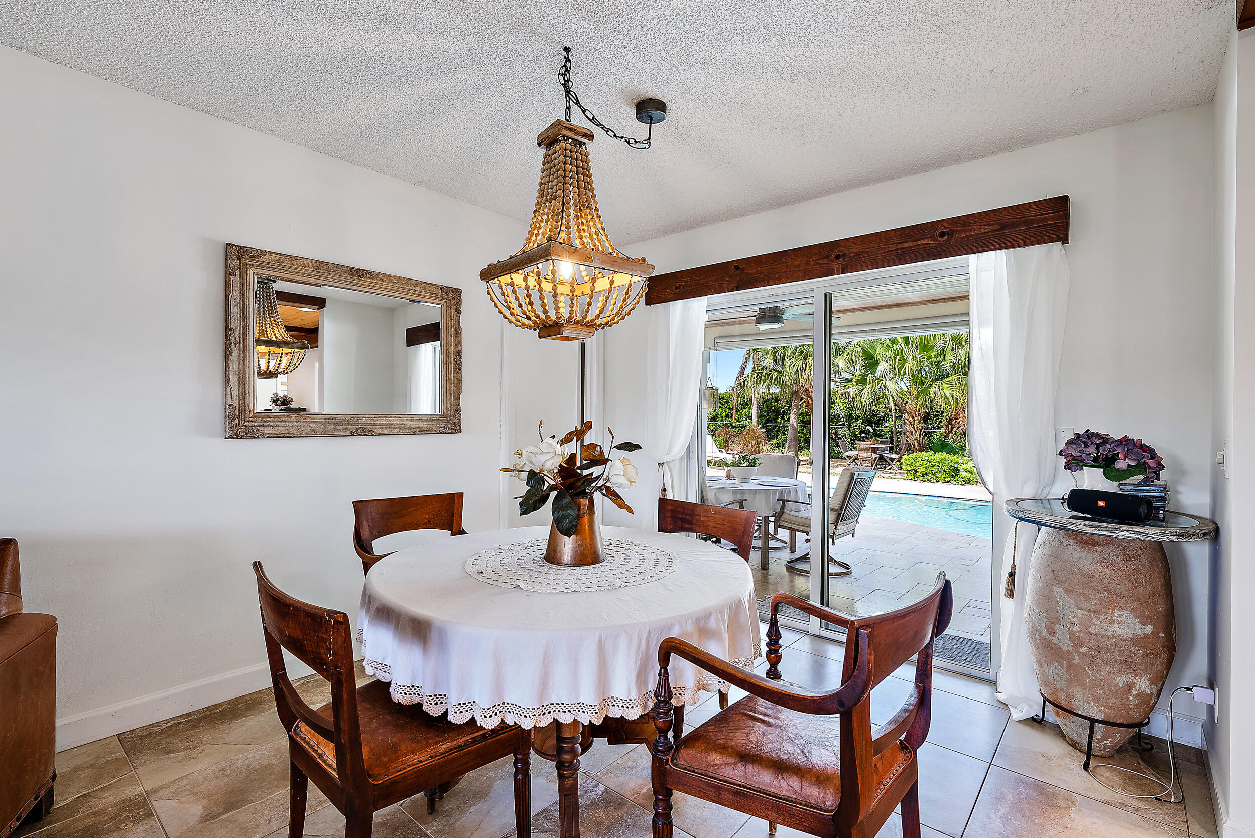83 Fairview West Tequesta, FL 33469 - Photo 6 of 32 a view of a dining room with furniture window and outside view