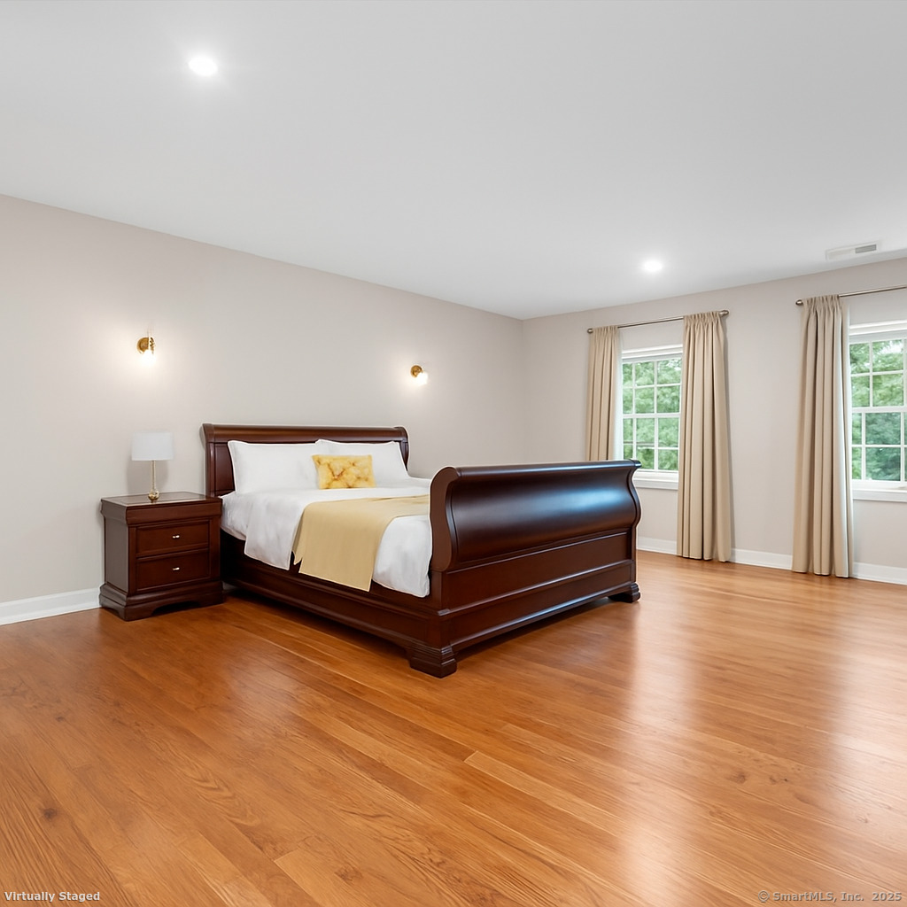 424 Racebrook Road Orange, CT 06477 - Photo 14 of 36 a bedroom with a bed and a couch