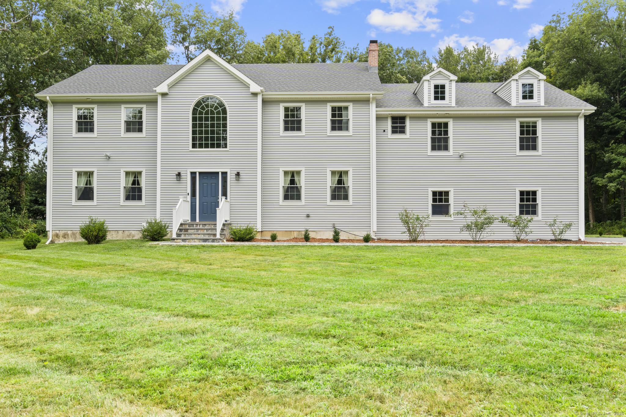 424 Racebrook Road Orange, CT 06477 - Photo 2 of 36 a front view of house with yard and green space