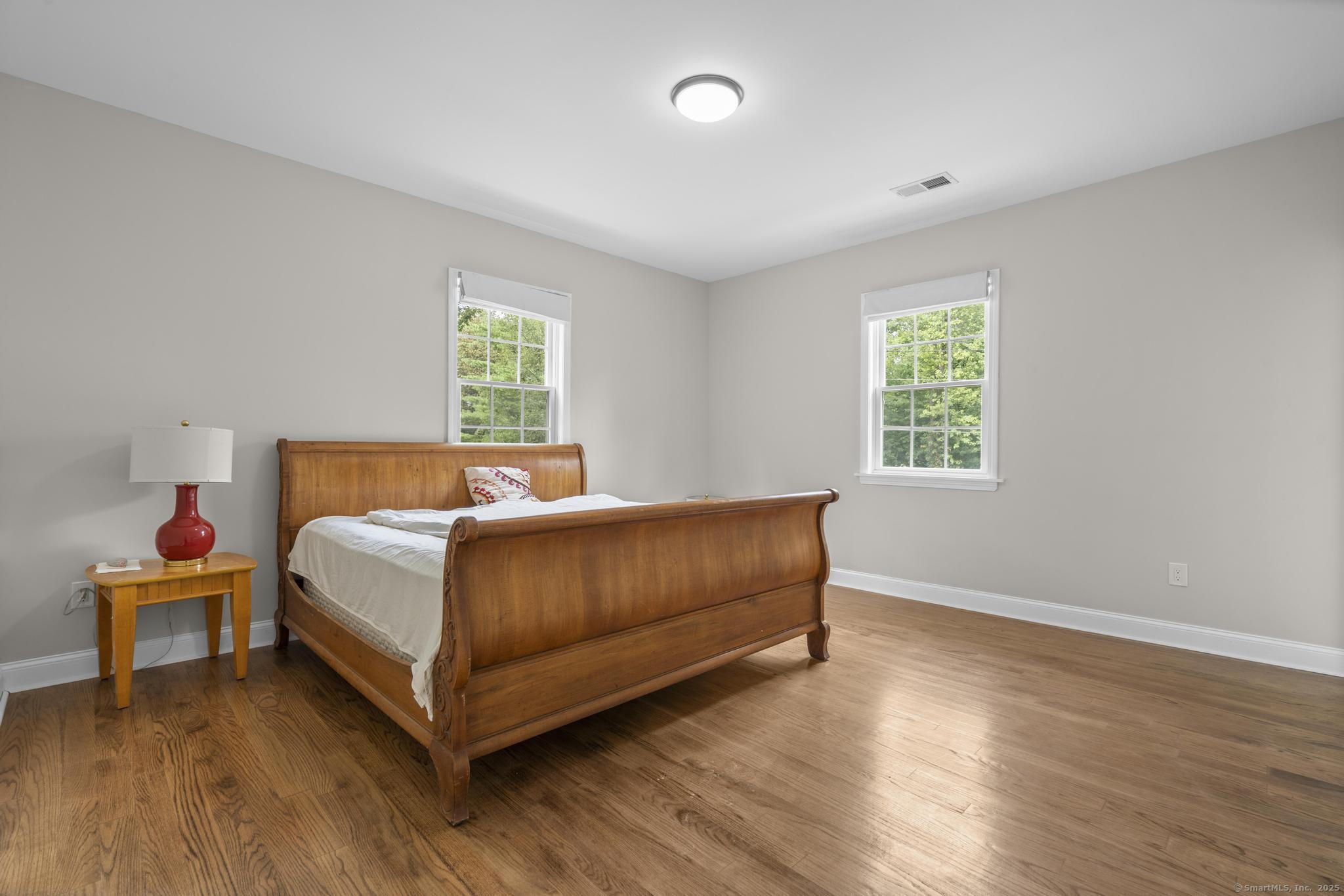 424 Racebrook Road Orange, CT 06477 - Photo 26 of 36 a bedroom with a bed and window