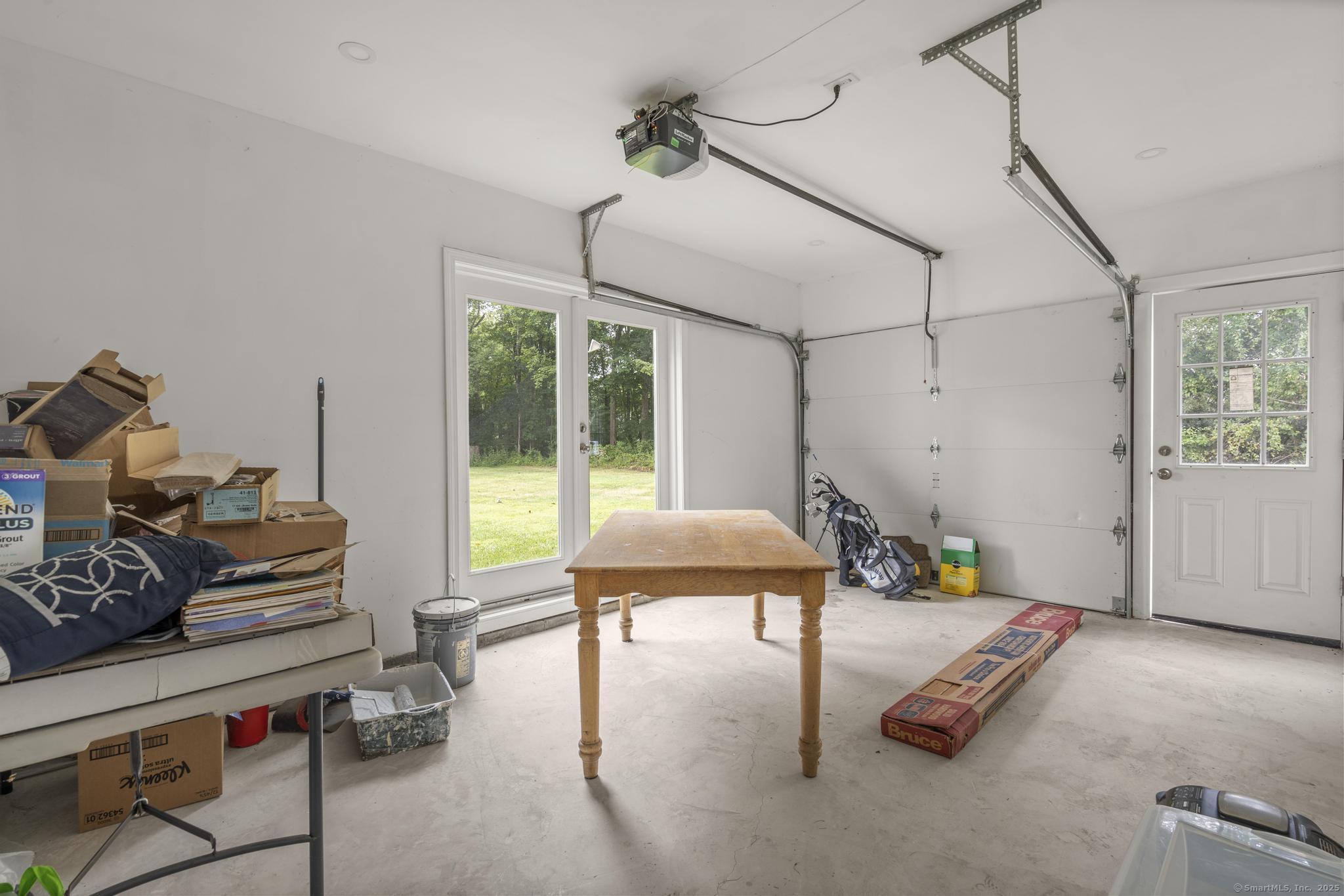 424 Racebrook Road Orange, CT 06477 - Photo 30 of 36 a bedroom with furniture and a wooden floor