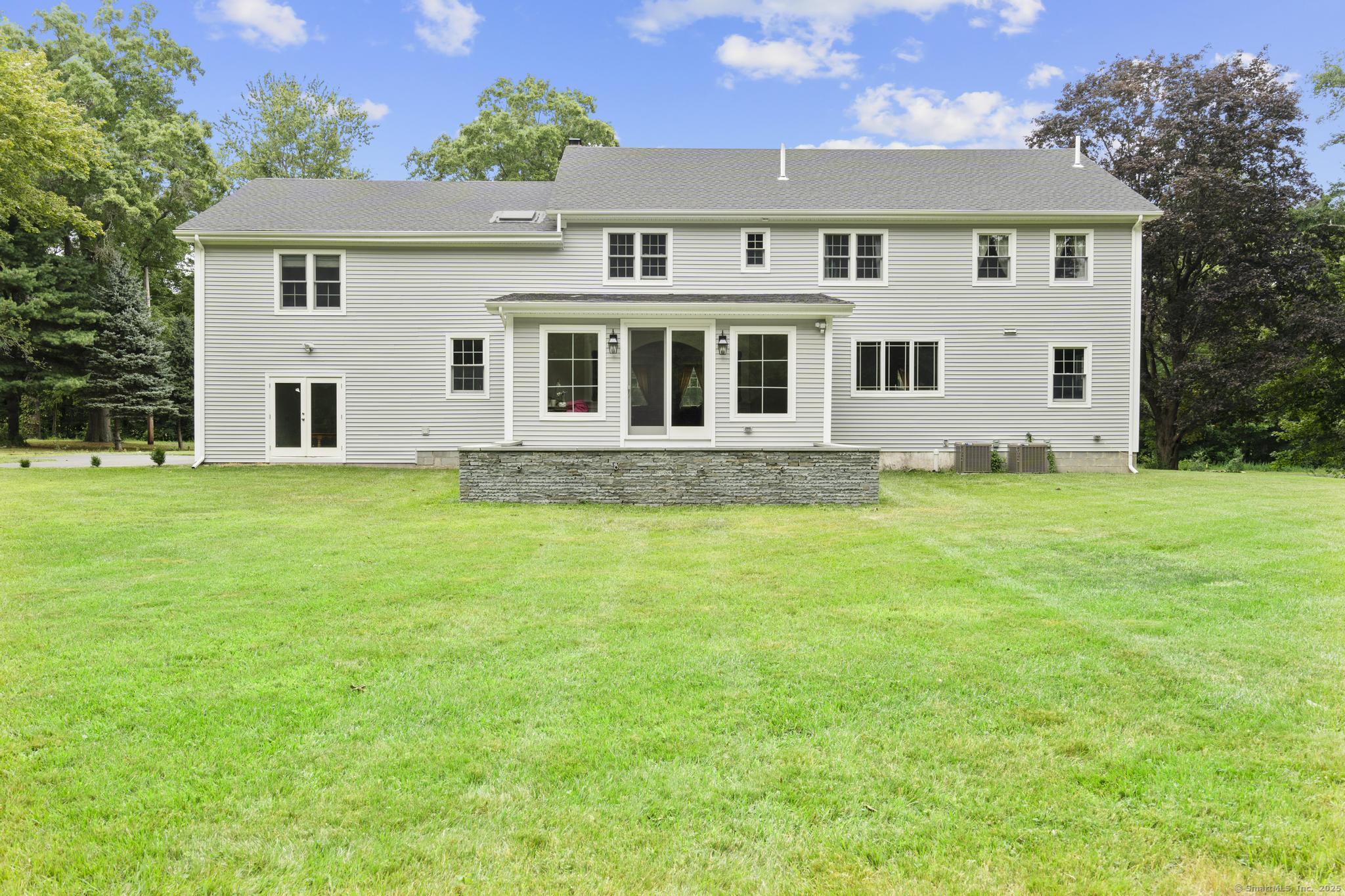 424 Racebrook Road Orange, CT 06477 - Photo 31 of 36 a front view of a house with a yard