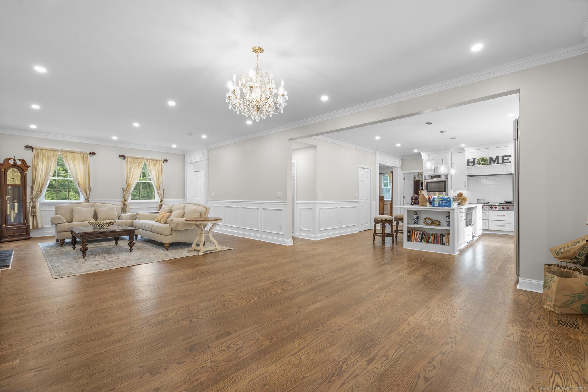 424 Racebrook Road Orange, CT 06477 - Photo 10 of 36 a view of a room with gym equipment and wooden floor