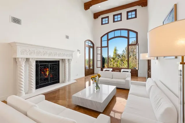 a view of a swimming pool with outdoor seating