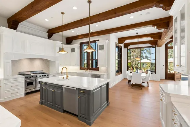 a view of swimming pool with outdoor seating and plants