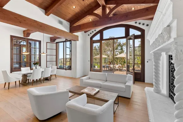 a spacious bedroom with a bed and a large window