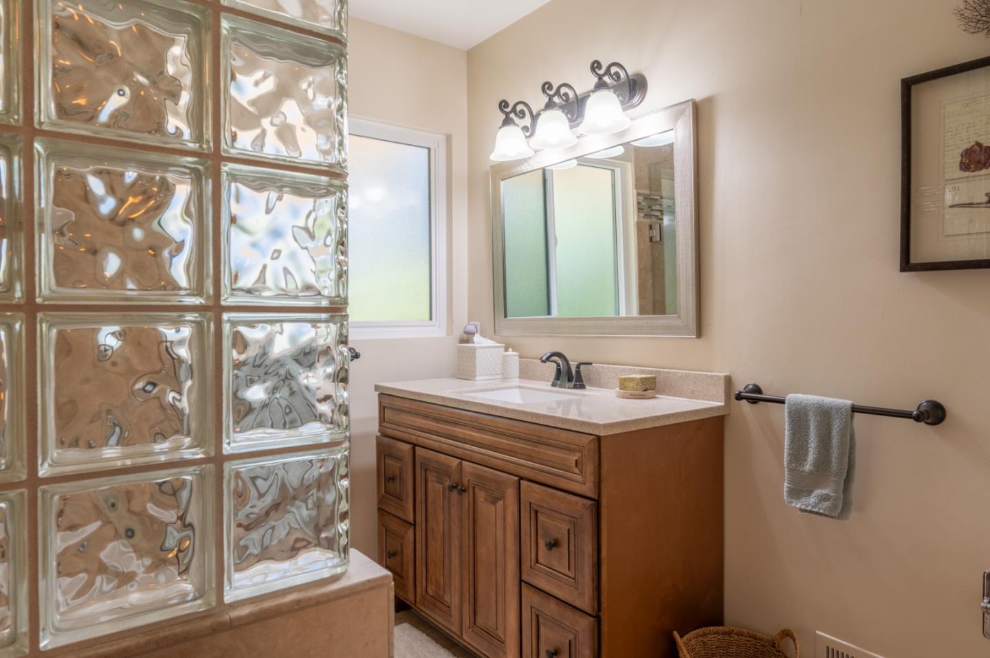 25324 Hatton Road Carmel, CA 93923 - Photo 11 of 19 a bathroom with a sink and a mirror