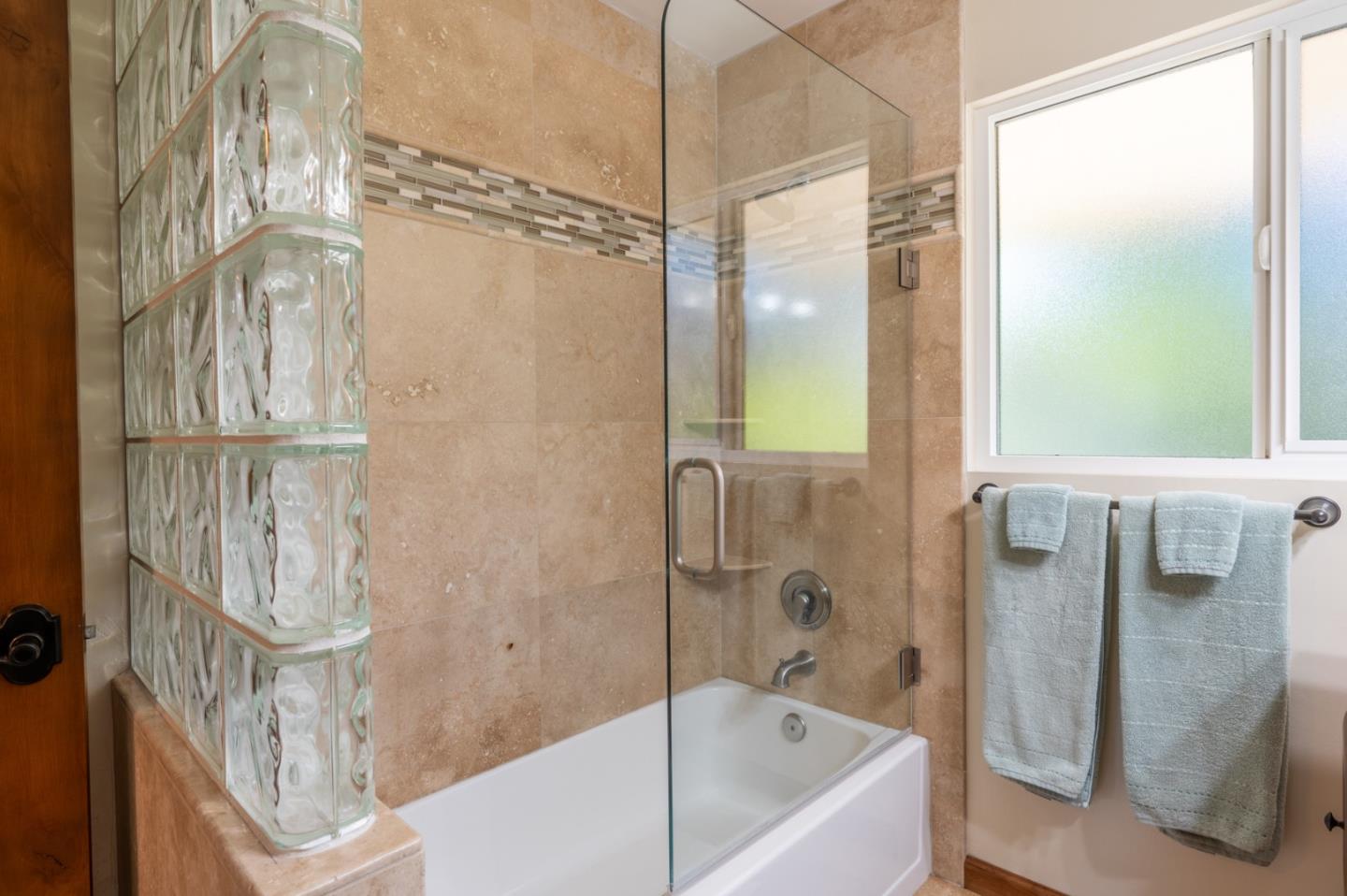 25324 Hatton Road Carmel, CA 93923 - Photo 12 of 19 a bathroom with a bathtub and shower