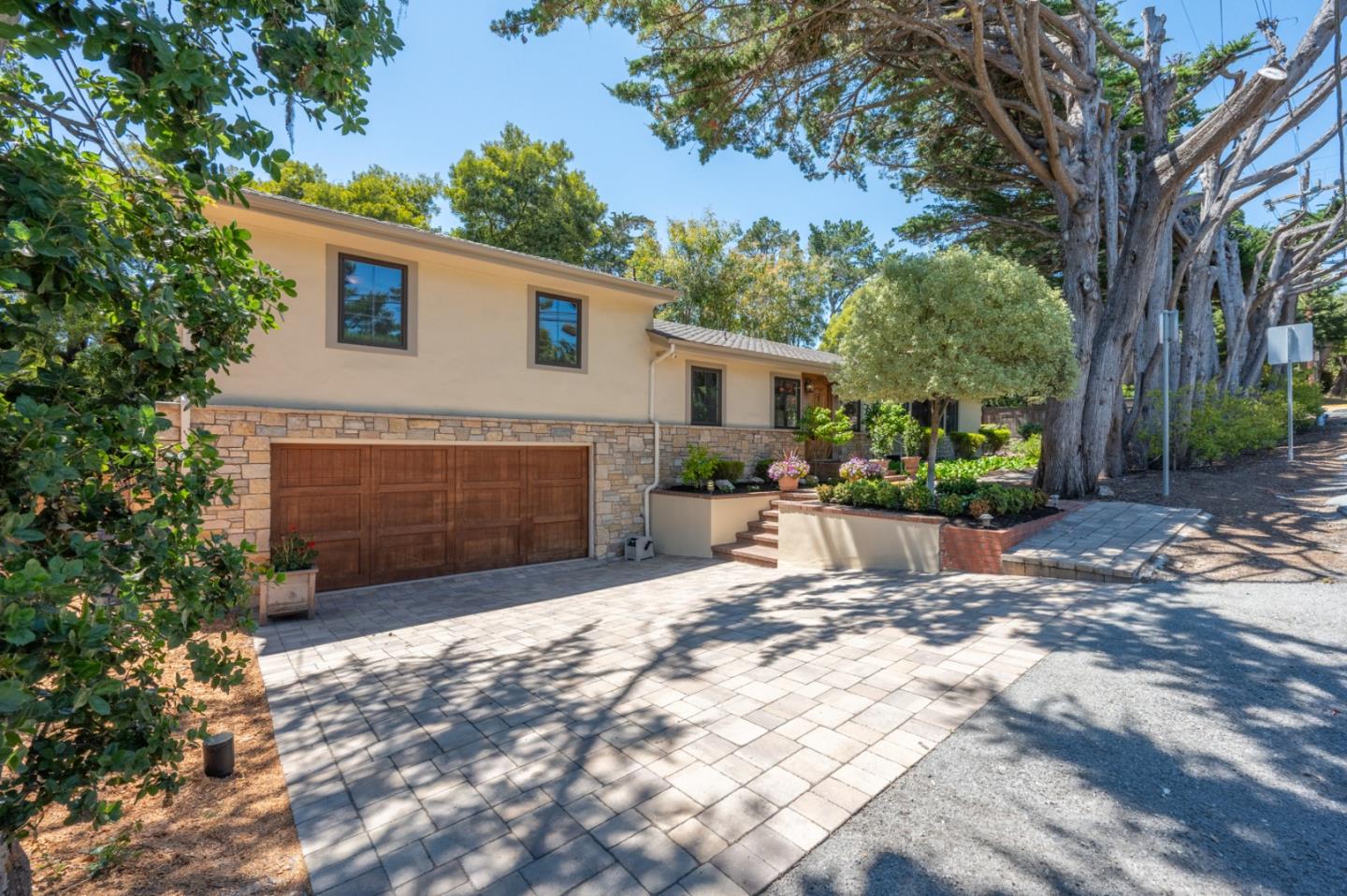 25324 Hatton Road Carmel, CA 93923 - Photo 18 of 19 a view of a house with a yard and potted plants