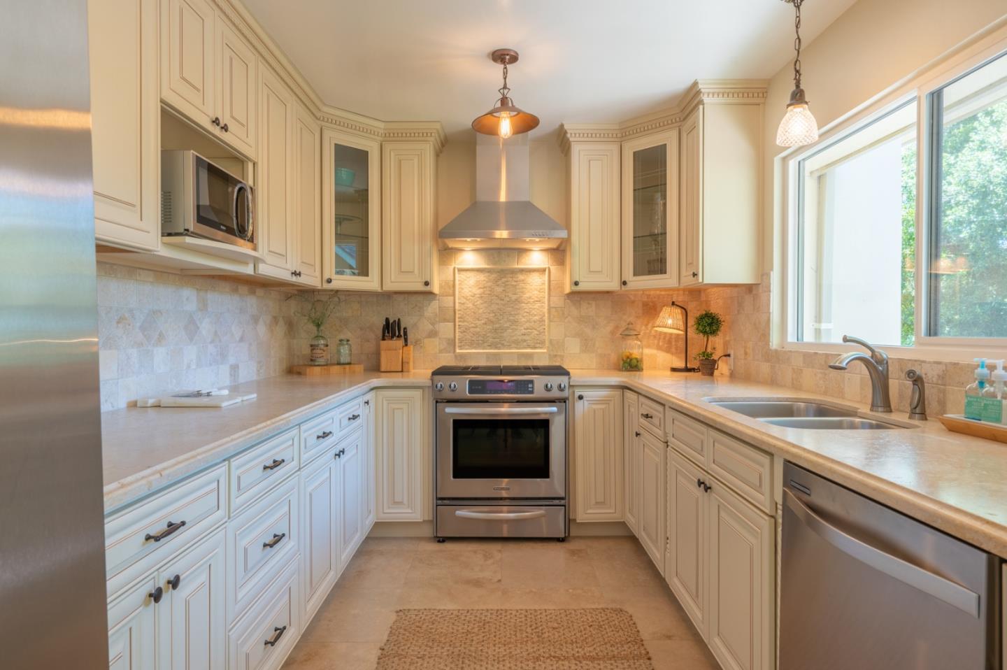 25324 Hatton Road Carmel, CA 93923 - Photo 7 of 19 a kitchen with stainless steel appliances granite countertop a stove and a sink