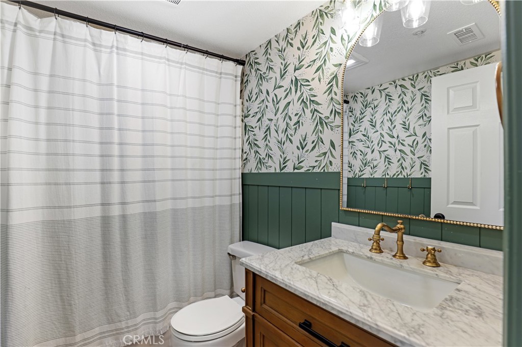 19 Garrison Loop Ladera Ranch, CA 92694 - Photo 11 of 21 a bathroom with a granite countertop sink and a mirror