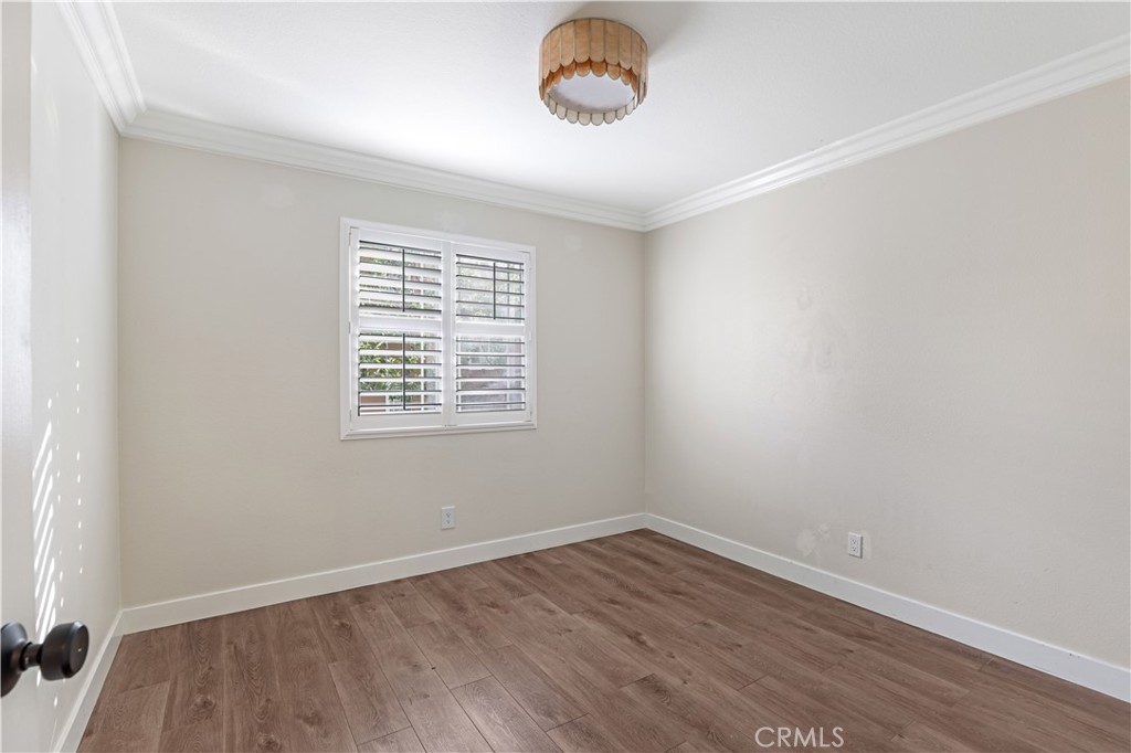 19 Garrison Loop Ladera Ranch, CA 92694 - Photo 12 of 21 an empty room with wooden floor and windows