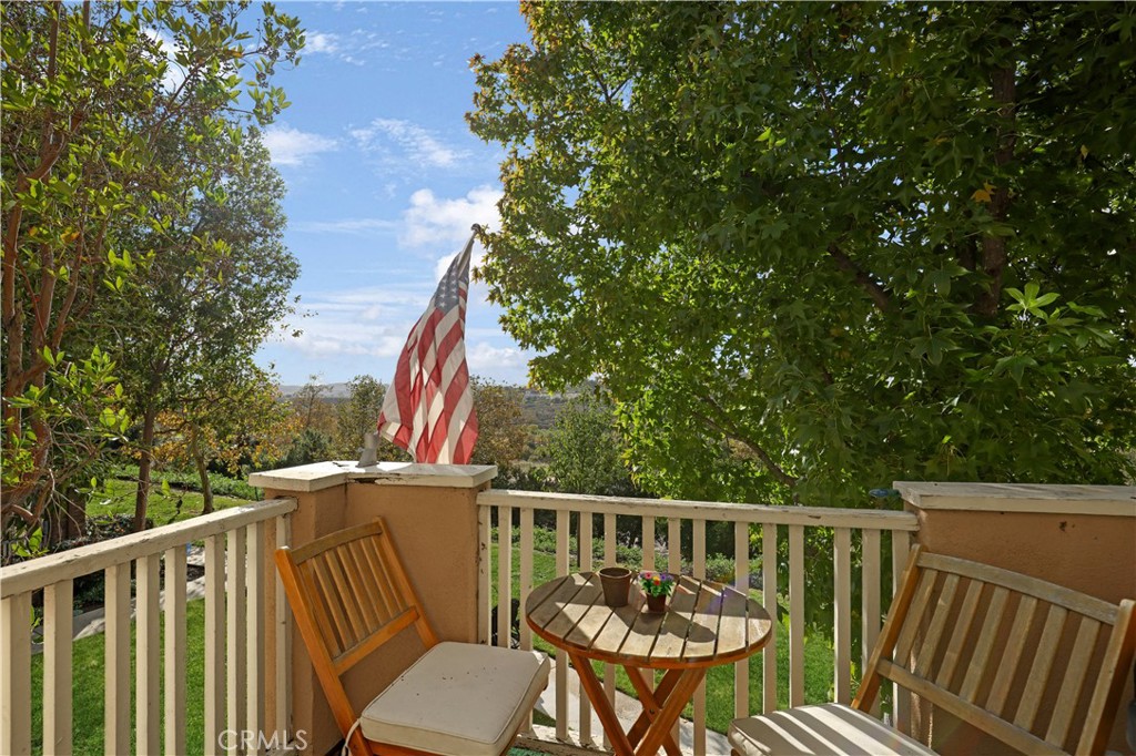 19 Garrison Loop Ladera Ranch, CA 92694 - Photo 2 of 21 a view of a balcony with wooden floor and fence