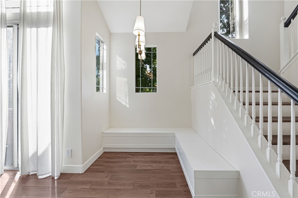 19 Garrison Loop Ladera Ranch, CA 92694 - Photo 8 of 21 a view of entryway and hall with wooden floor