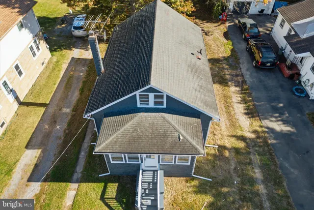 a aerial view of a house with swimming pool