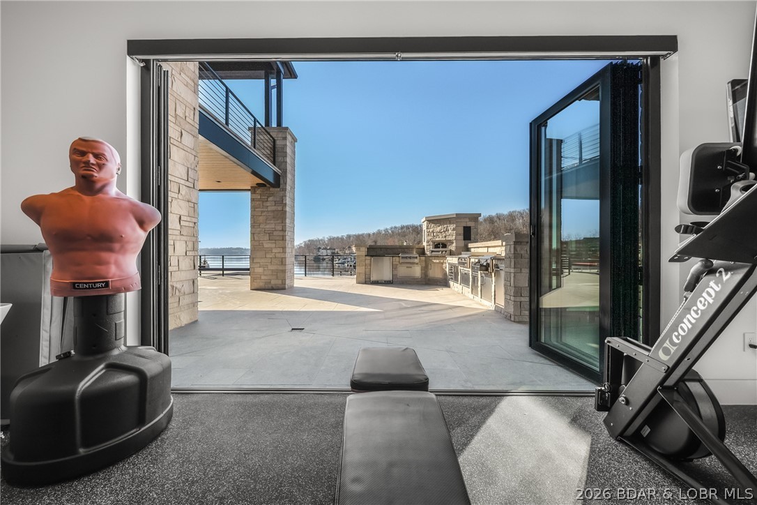245 Waterview Ridge Sunrise Beach, MO 65079 - Photo 21 of 43 Fitness Room Opened to Outdoors