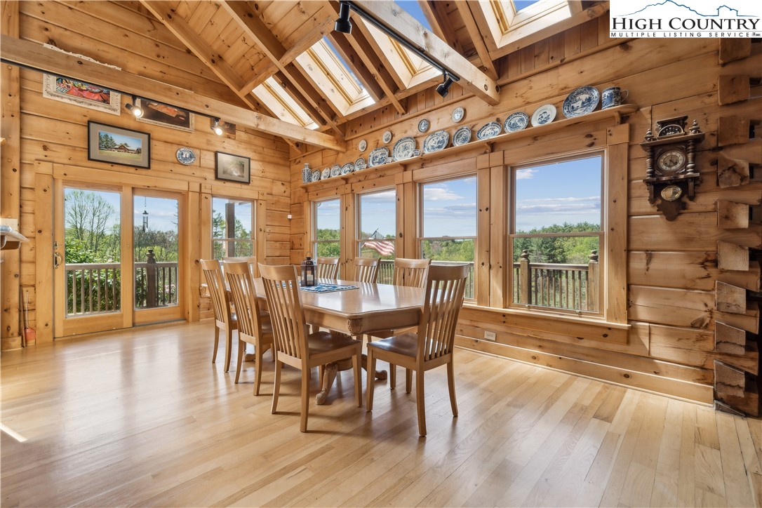 101 Double Branch Road Grassy Creek, NC 28631 - Photo 11 of 50 a view of a dining room with furniture window and wooden floor