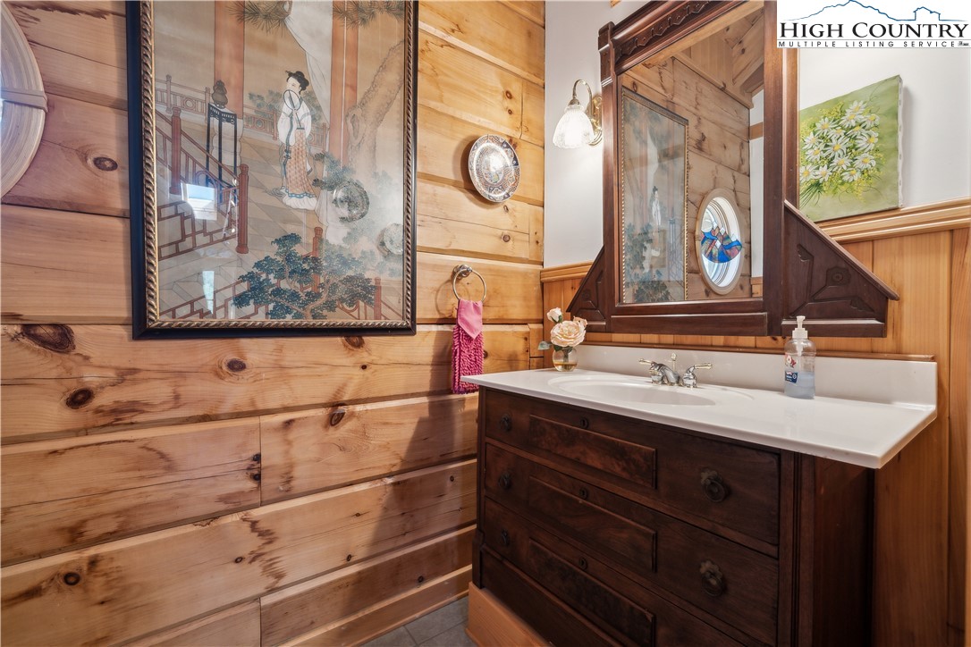 101 Double Branch Road Grassy Creek, NC 28631 - Photo 16 of 50 a bathroom with a sink and a mirror