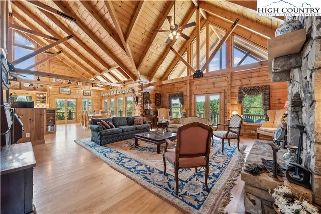 a living room with furniture and a chandelier