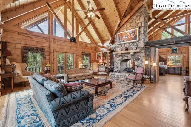 a building outdoor space with patio furniture and wooden floor