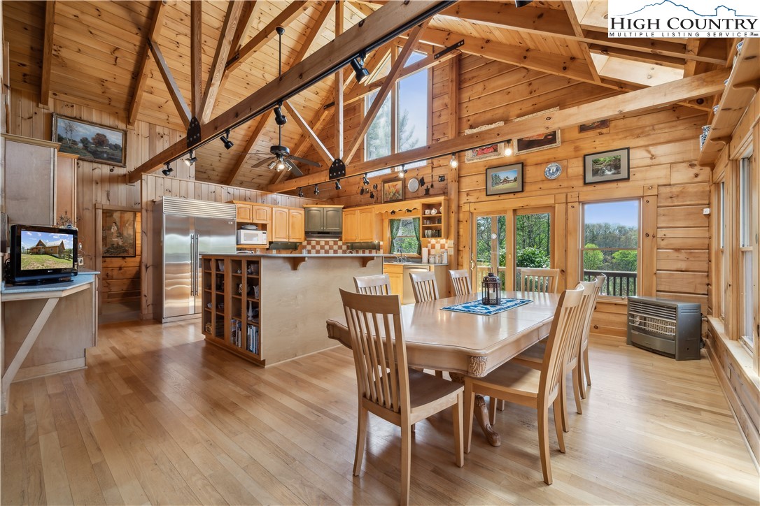 101 Double Branch Road Grassy Creek, NC 28631 - Photo 21 of 50 a dining room with furniture and wooden floor