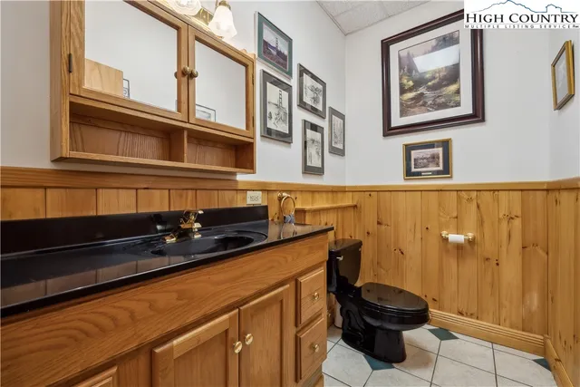 a bedroom with furniture and a book shelf