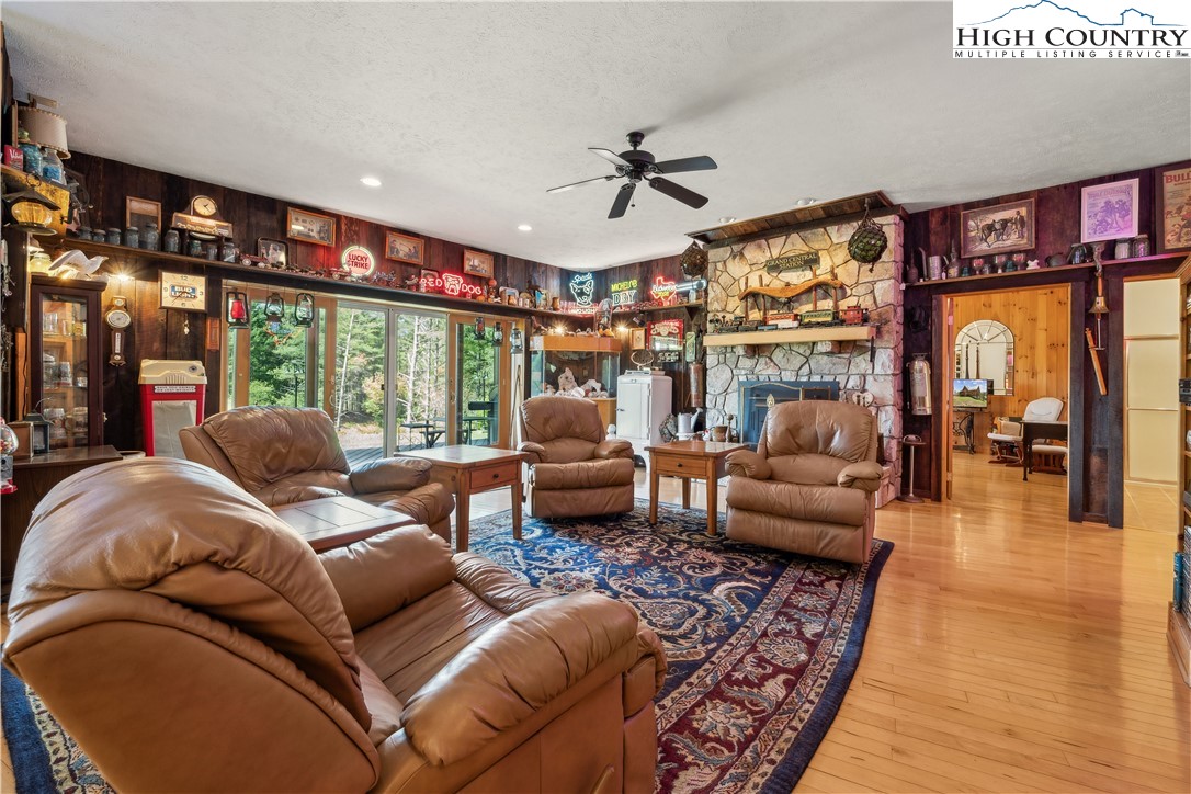 101 Double Branch Road Grassy Creek, NC 28631 - Photo 40 of 50 a living room with furniture and a floor to ceiling window