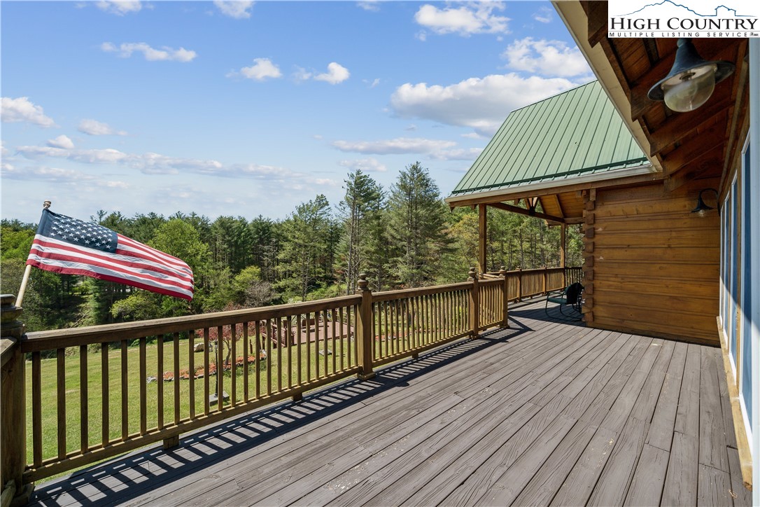 101 Double Branch Road Grassy Creek, NC 28631 - Photo 42 of 50 a view of balcony with wooden floor