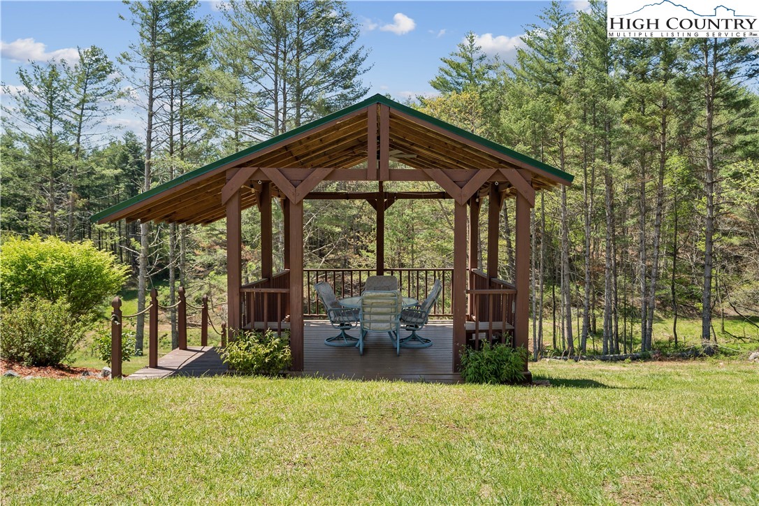 101 Double Branch Road Grassy Creek, NC 28631 - Photo 46 of 50 a backyard of a house with a yard table and chairs