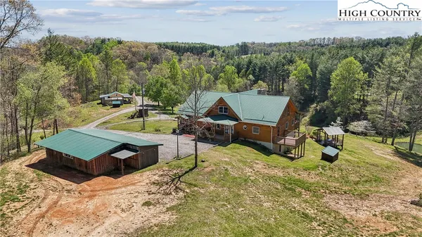 a view of a chairs and table on the wooden floor