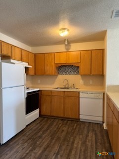 4409 Jeff Scott Drive, Unit B Killeen, TX 76549 - Photo 2 of 5 a kitchen with a refrigerator and a sink