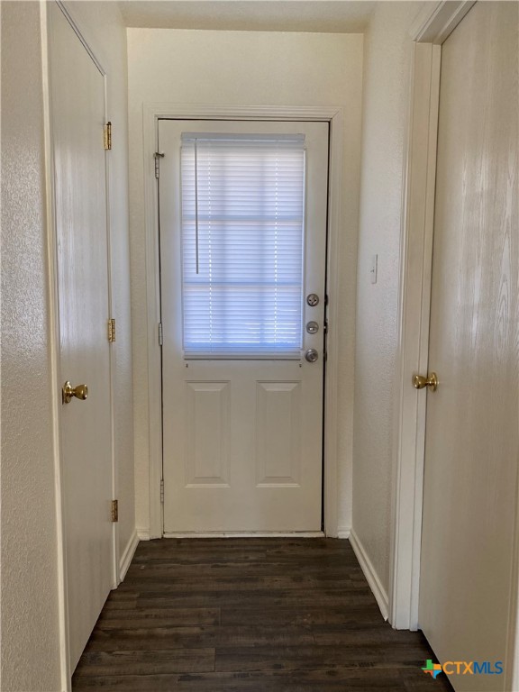 4409 Jeff Scott Drive, Unit B Killeen, TX 76549 - Photo 5 of 5 a view of an empty room with wooden floor and a window