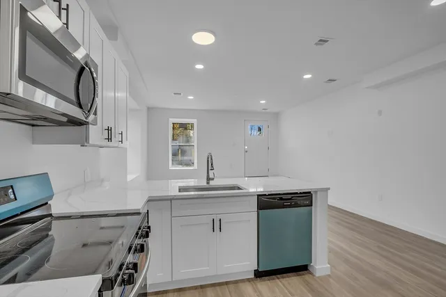 a utility room with a sink dryer and washer