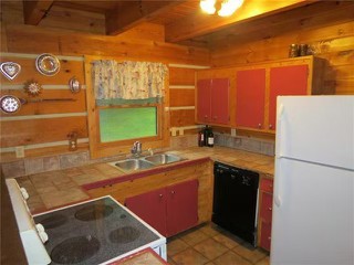 3103 Lipscomb Road Springfield, TN 37172 - Photo 21 of 30 a kitchen with a sink and a refrigerator