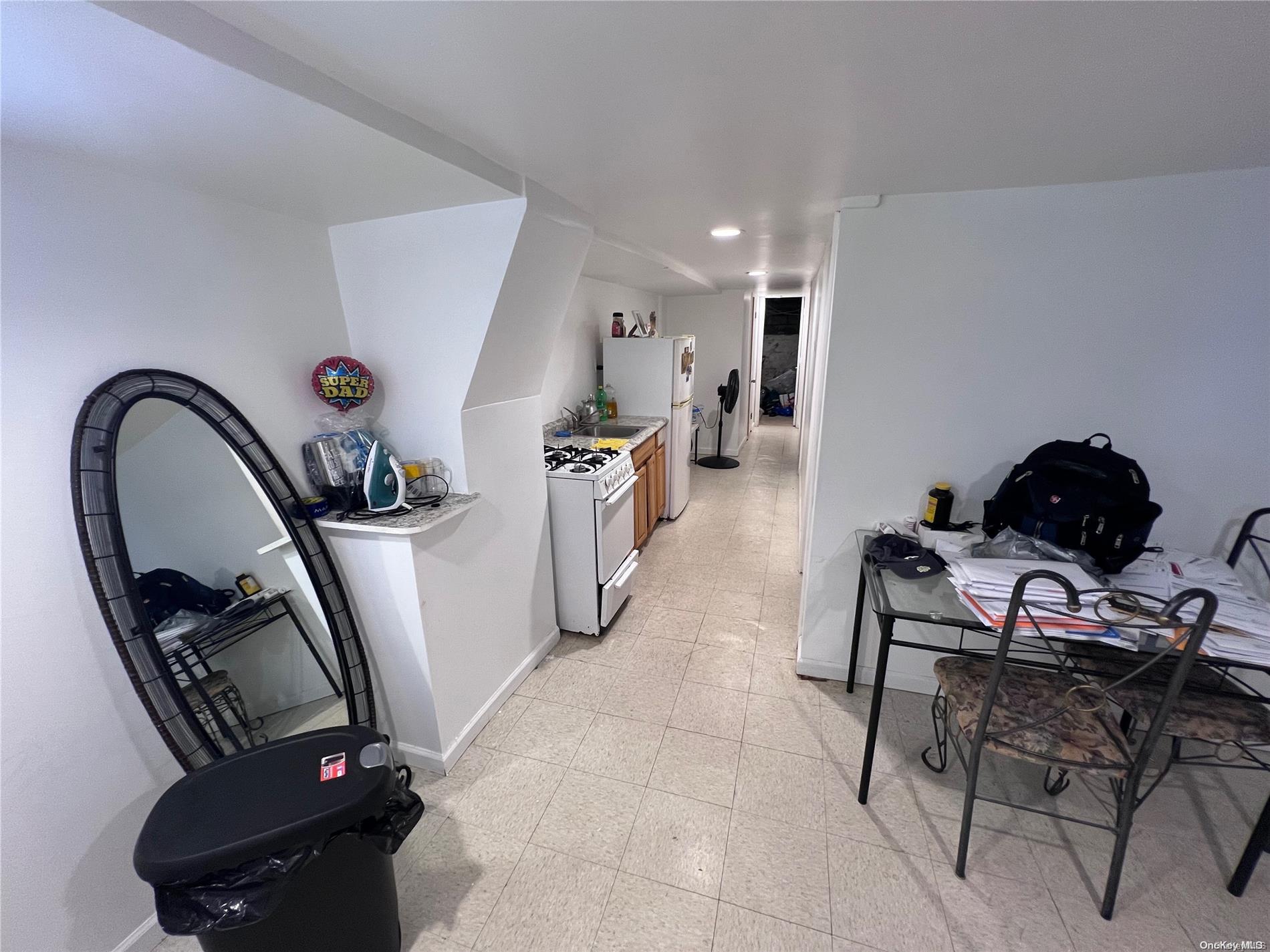91-18 87th Street Queens, NY 11421 - Photo 14 of 22 a living room with furniture a rug and a window