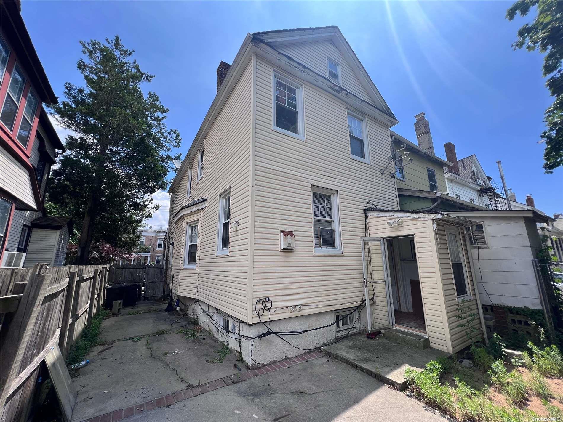 91-18 87th Street Queens, NY 11421 - Photo 21 of 22 a view of a house with a yard