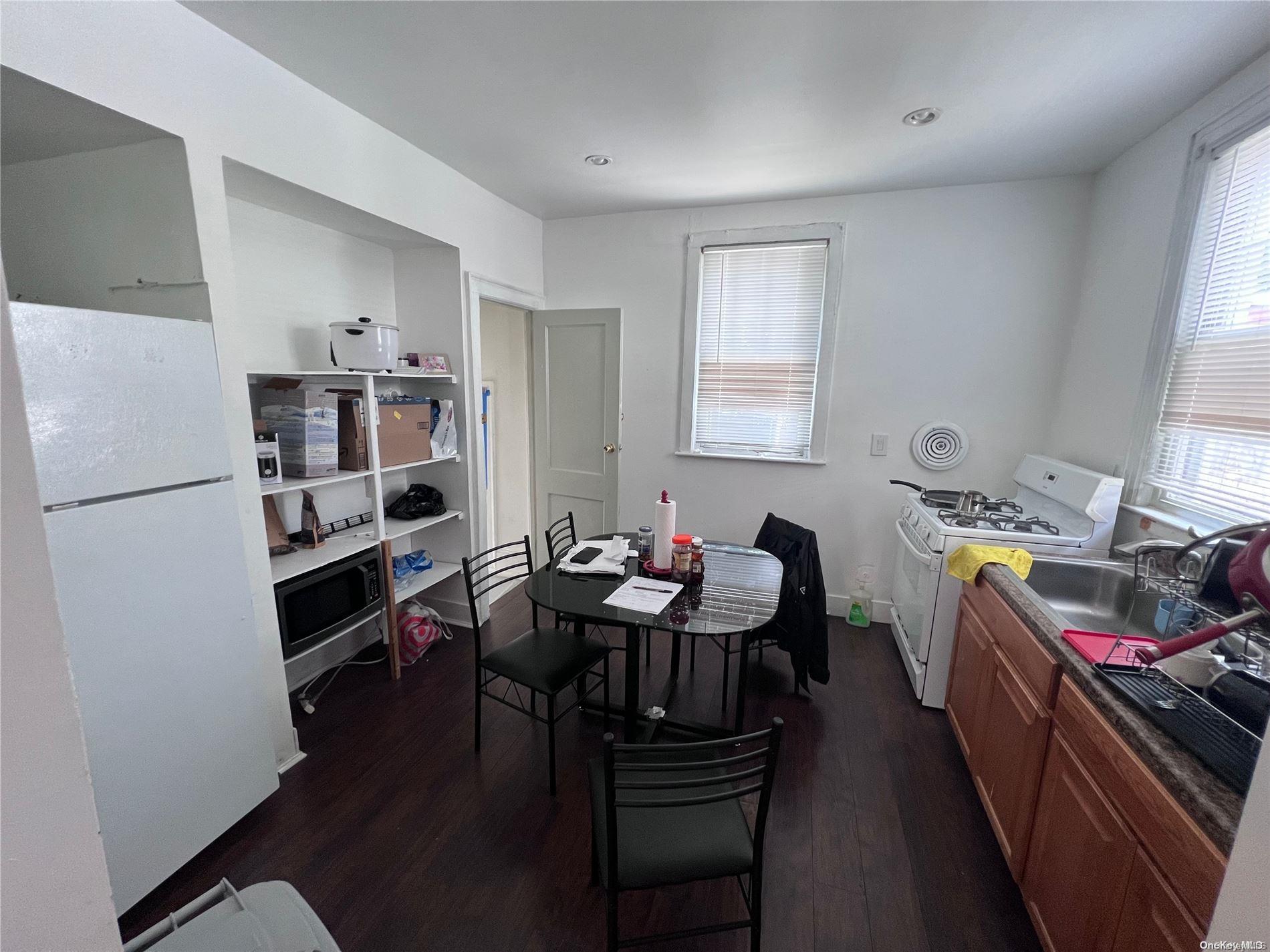 91-18 87th Street Queens, NY 11421 - Photo 4 of 22 a view of a kitchen and dining room