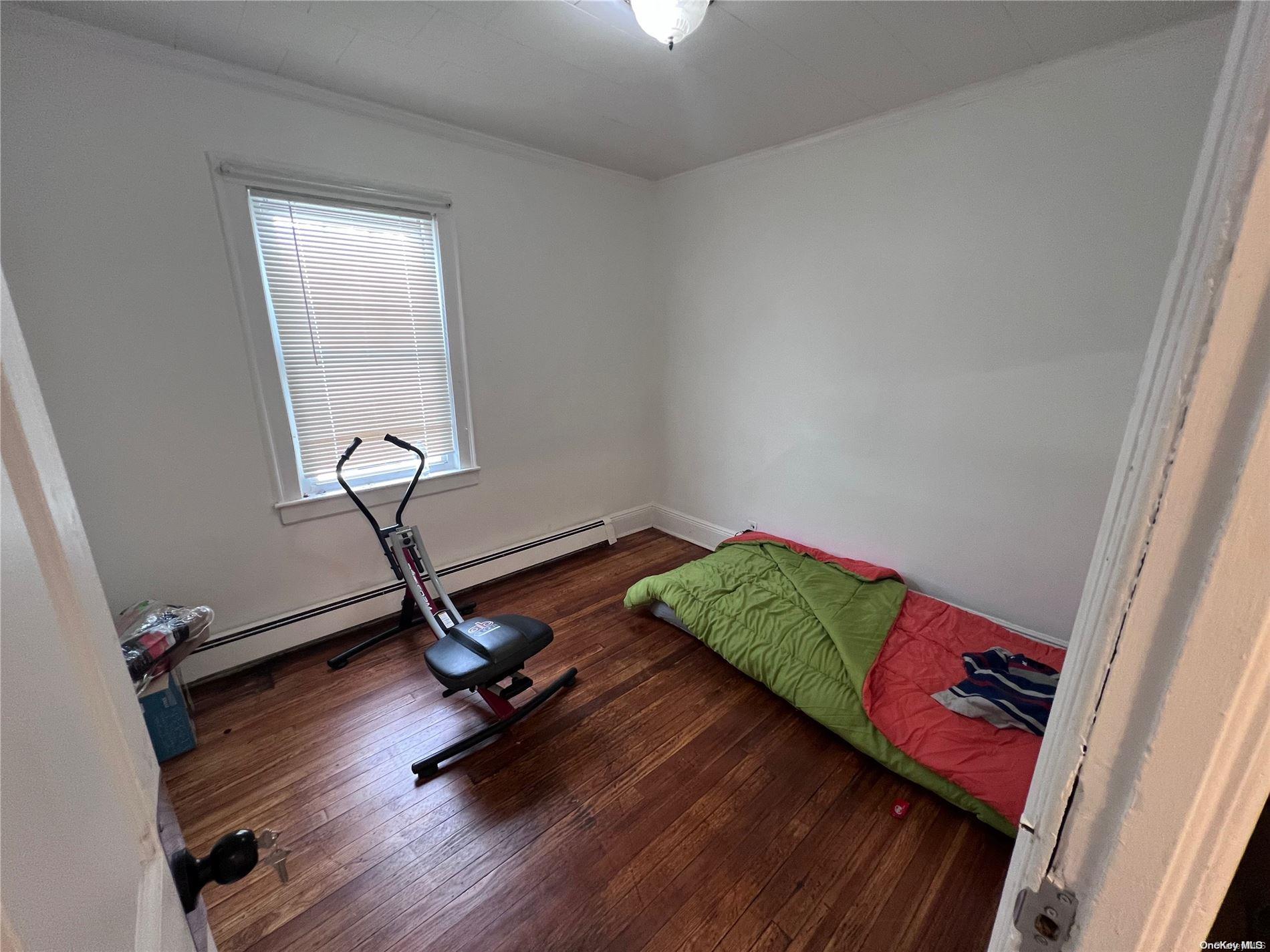 91-18 87th Street Queens, NY 11421 - Photo 10 of 22 a view of a room with gym equipment