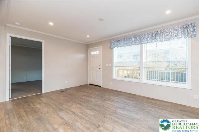 a view of an empty room with a window