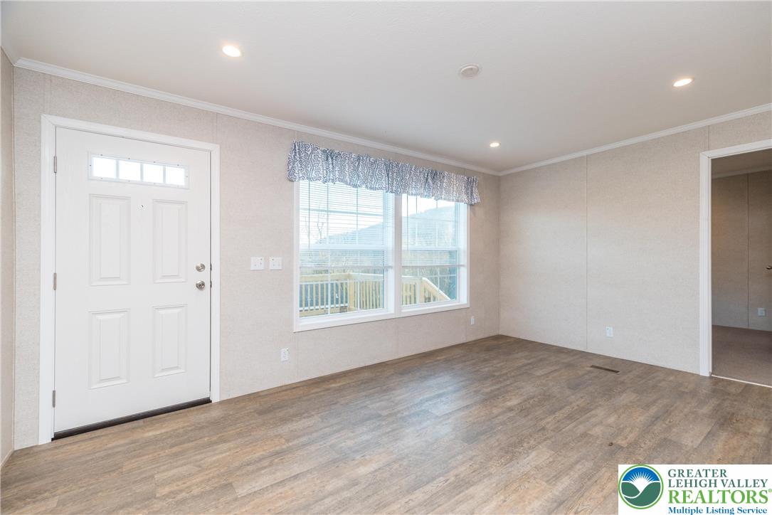 465 Royal Manor Road, Unit LOT 5 Easton, PA 18042 - Photo 12 of 24 a view of an empty room with wooden floor and a window