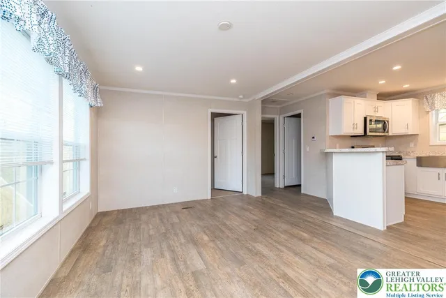 a view of a kitchen with a sink and a window