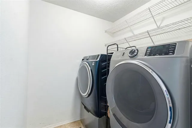 a room with furniture and paintings on the wall