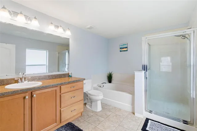 a bathroom with a bathtub and toilet