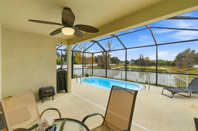 a view of a swimming pool with a porch