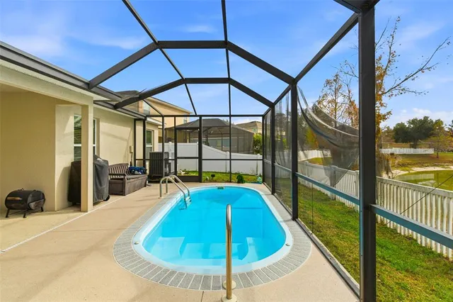 a bedroom with a bed and a table