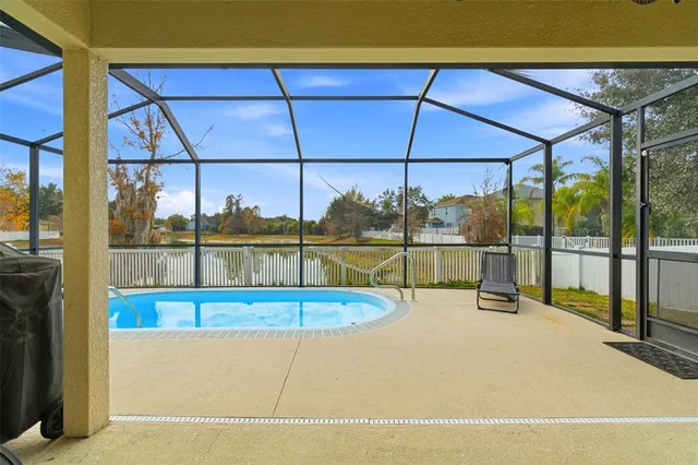 a view of an house with backyard and balcony