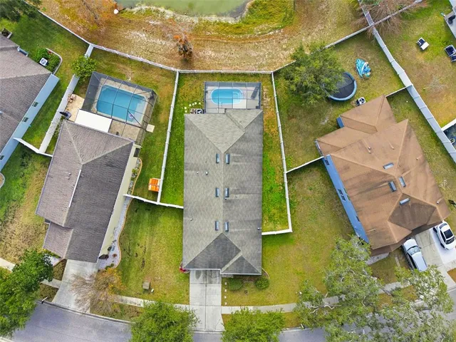 an aerial view of a house with a garden