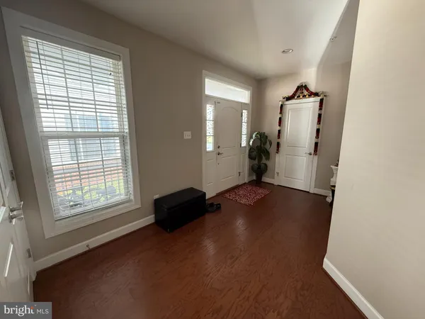 a view of room with window and a wooden floor